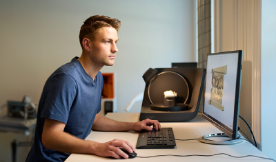 Person using 3Shape F8 lab scanner